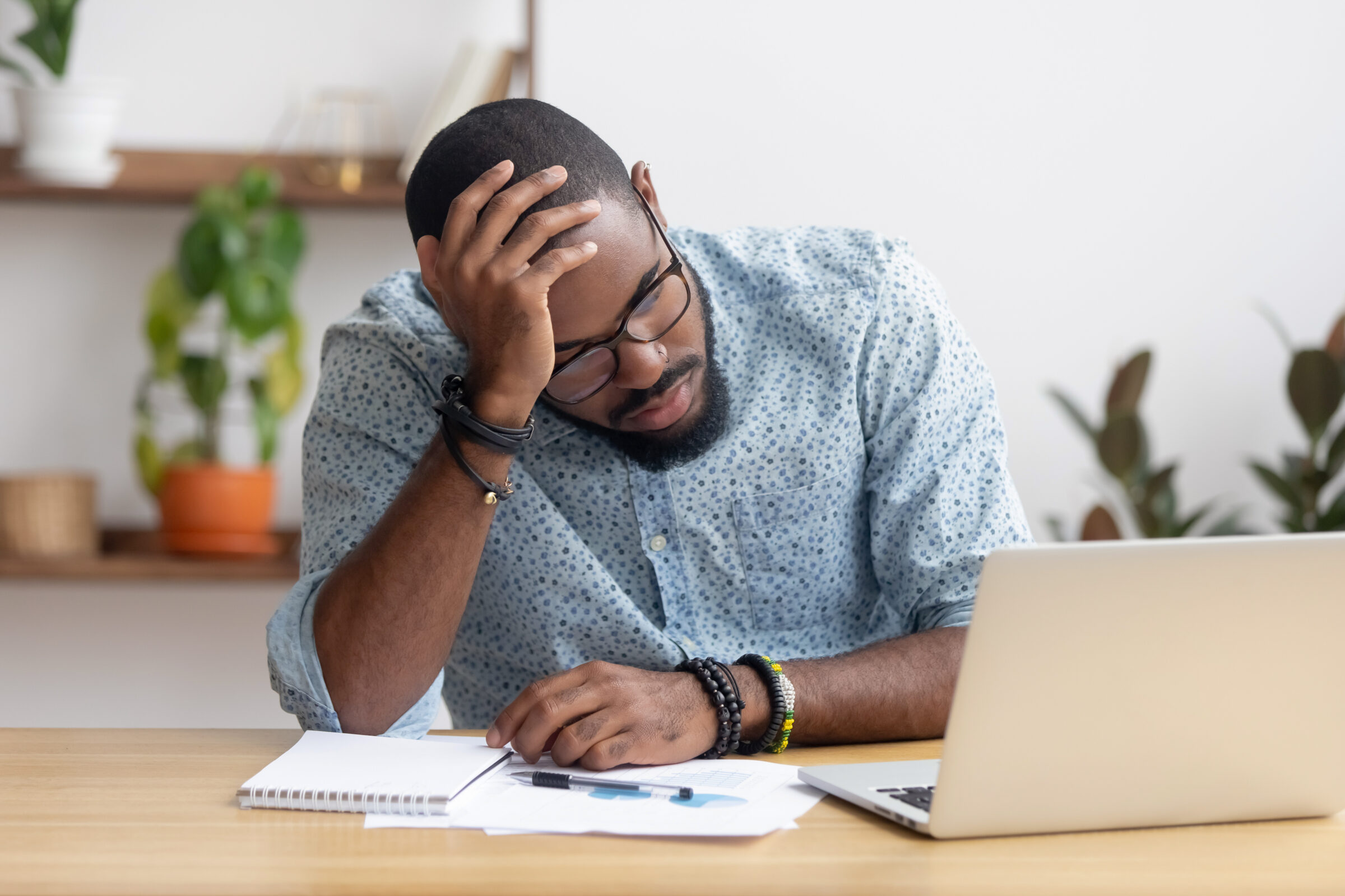 Stressed and Tired Man Working in an Office